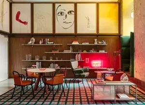 A modern lounge area with mixed materials and unique art pieces.