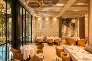 Modern interior of a restaurant featuring metal and lighting design.