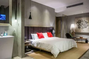 Modern bedroom featuring a concrete and wood interior design