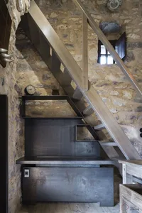 An industrial-style office interior with metal and wood elements