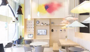 A modern, minimalist office space featuring mixed materials and sleek design elements.