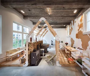 A spacious retail environment featuring exposed wooden beams and concrete flooring, designed with industrial aesthetics.