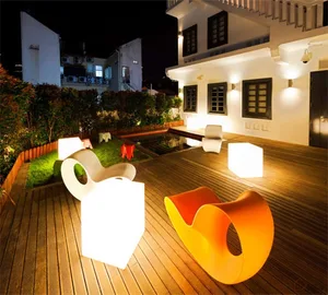 Contemporary outdoor seating area with illuminated cube lights, designed for aesthetic appeal and functional use.