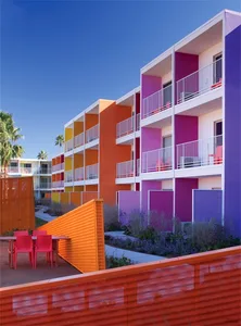 A modern residential building painted with bright, colorful paint.