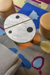 A modern industrial-style side table featuring a marble top and wooden legs.
