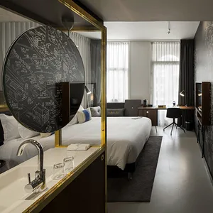 Modern, minimalist bedroom featuring a concrete desk.