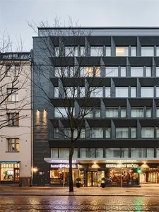 Modern storefront with brick facade and glass windows.