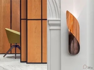 A modern interior design featuring a metallic wall-hanging decor