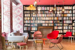 A modern library with a mix of materials and colorful seating.