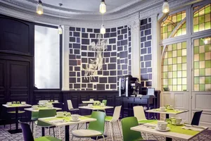 A modern restaurant interior with acrylic and green accents.