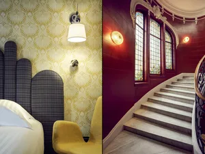 Industrial design bedroom with a yellow wallpaper and upholstered headboards.
