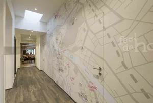 Wallpaper featuring a map of a city on an interior wall
