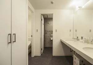 White-walled bathroom with a modern design.
