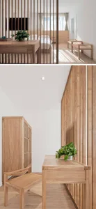 A modern bedroom featuring wood-paneled walls, a wooden desk, and a bed with a wooden headboard.