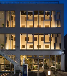 Modern restaurant-bar interior with large glass windows and tiled flooring