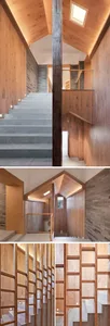 A modern hallway with wooden walls and stairs, a skylight, and built-in wooden shelves.