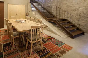 Modern dining room with wooden table and concrete floor