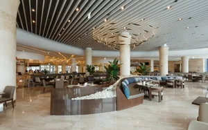 Modern restaurant bar with a concrete floor and ceiling.