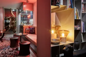 A modern reception space with contemporary decor and unique lighting fixtures.