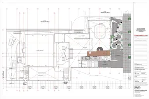 Floor plan of a modern restaurant interior with a metal driveway, wooden seating, glass walls, and concrete flooring.