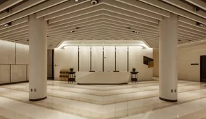 Modern industrial lobby interior with concrete flooring and minimalist design.