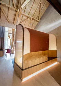 A minimalist interior design featuring wooden furniture and a light interior design.