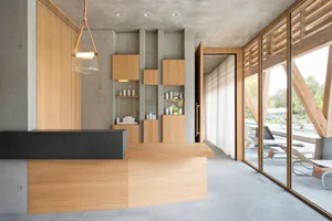 A modern interior design featuring a reception counter crafted from wood and concrete.