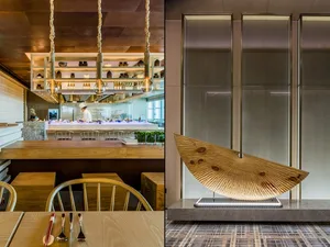 Modern restaurant interior design featuring wooden kitchen and bar counter.