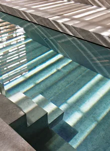Modern swimming pool designed with concrete material.