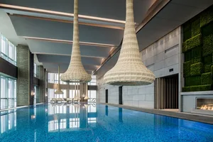 Modern interior of a swimming pool with glass and ceramic tiles