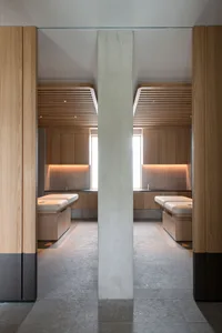 A modern spa interior with wooden elements and minimalistic design.