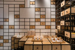 An industrial retail storefront featuring wooden paneling and shelving units.