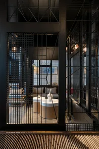 Industrial-style lobby area with concrete and glass materials.