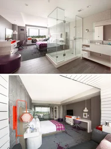 A modern hotel suite featuring a glass-enclosed shower and concrete walls with a leather ottoman and hexagonal tiles