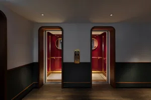 A modern lobby featuring red material, designed for comfort.