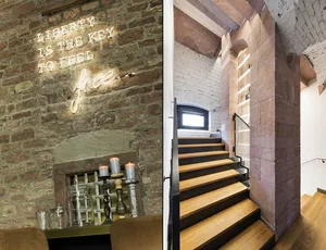 Modern lounge area with brick walls and concrete accents