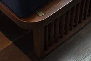 Modern minimalist wooden bedside table featuring a dark wood finish and a sleek, clean design.