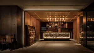 Modern minimalist reception desk made of wood and glass.
