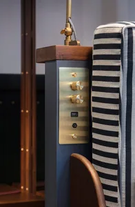 Close-up of an industrial-style sideboard made of metal with a brass finish.