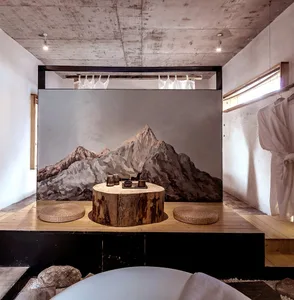 A minimalist interior design with a wooden space featuring a tree trunk table and woven baskets