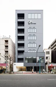 Modern gray concrete building with a minimalist design.