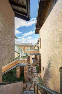 Stone pathway with modern architecture in a cityscape.
