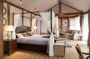 A cozy bedroom with a canopy bed, wooden furniture, and soft lighting.