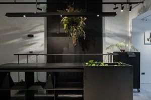 An industrial-style office space featuring metal and concrete materials.