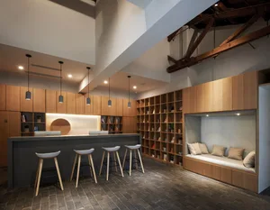 Modern cafe bar with wooden furniture and bar stools.
