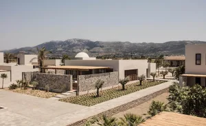 Modern residential architecture showcasing concrete and stone materials.