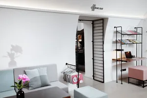 Modern interior living room featuring contemporary furniture pieces and minimalist design elements.