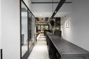 A modern commercial interior showcasing a concrete counter with a minimalist design.