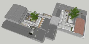 Aerial view of an urban rooftop terrace featuring concrete, glass, and wooden elements.