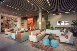 Industrial-style lounge space with concrete flooring and fabric seating.